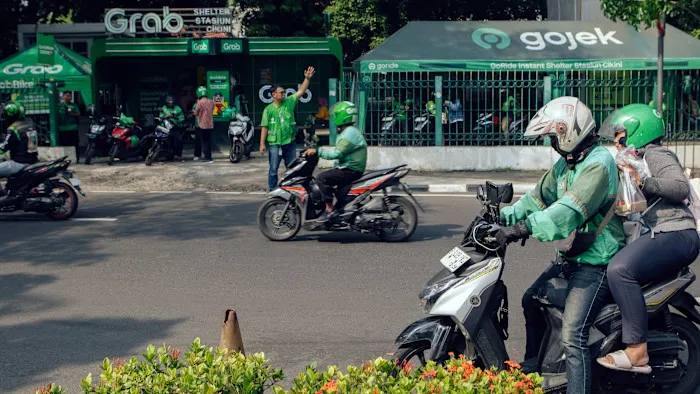 Grab and GoTo under pressure over driver deals as shares slump